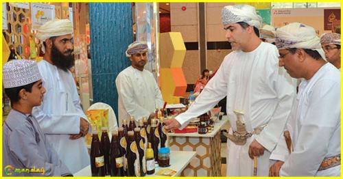 Al Rahbi visits a stall at the Omani Honey Market.