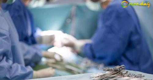Woman sues over nude photos taken of her on operating table