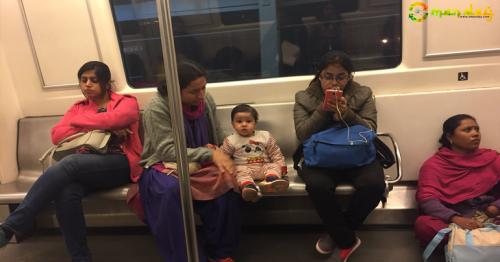 Picture of a nanny sitting on floor while mother and child take seats in Delhi metro sparks debate