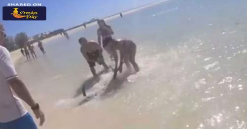 Video: Woman Helps Beached Marlin Fish Back Into The Sea
