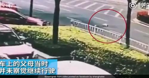 Shocking moment 10 month old baby fell out of a van onto busy street in China