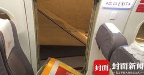 Air passenger opens emergency exit to get some fresh air as plane prepares for take-off