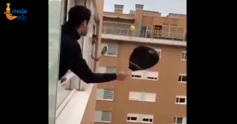 Coronavirus: Two quarantined Italian men play tennis across apartment windows. 